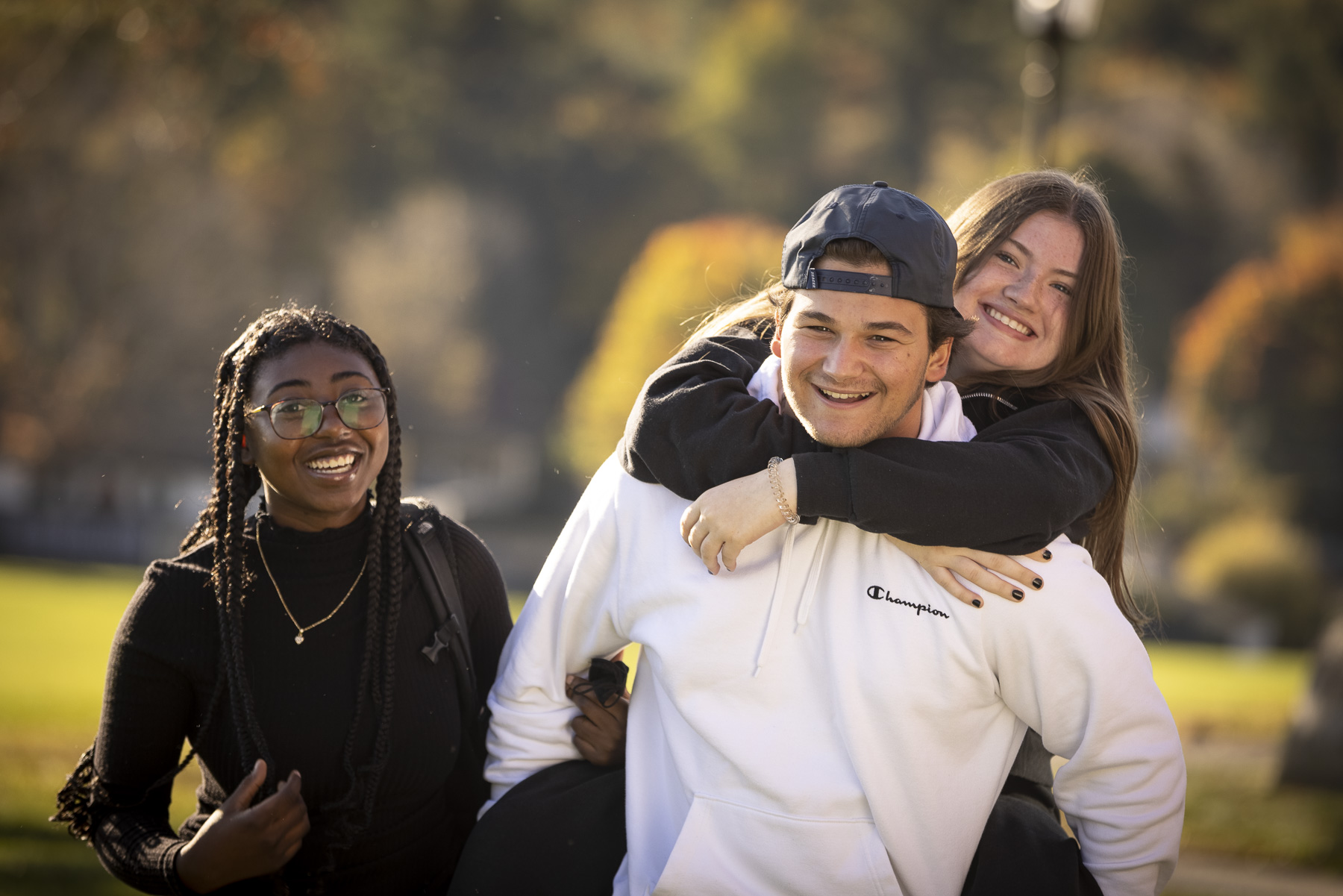 Three happy Cushing students smiling for the camera.